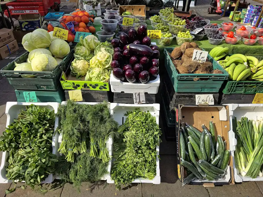 A fruit and vegetable stall at an outdoor market