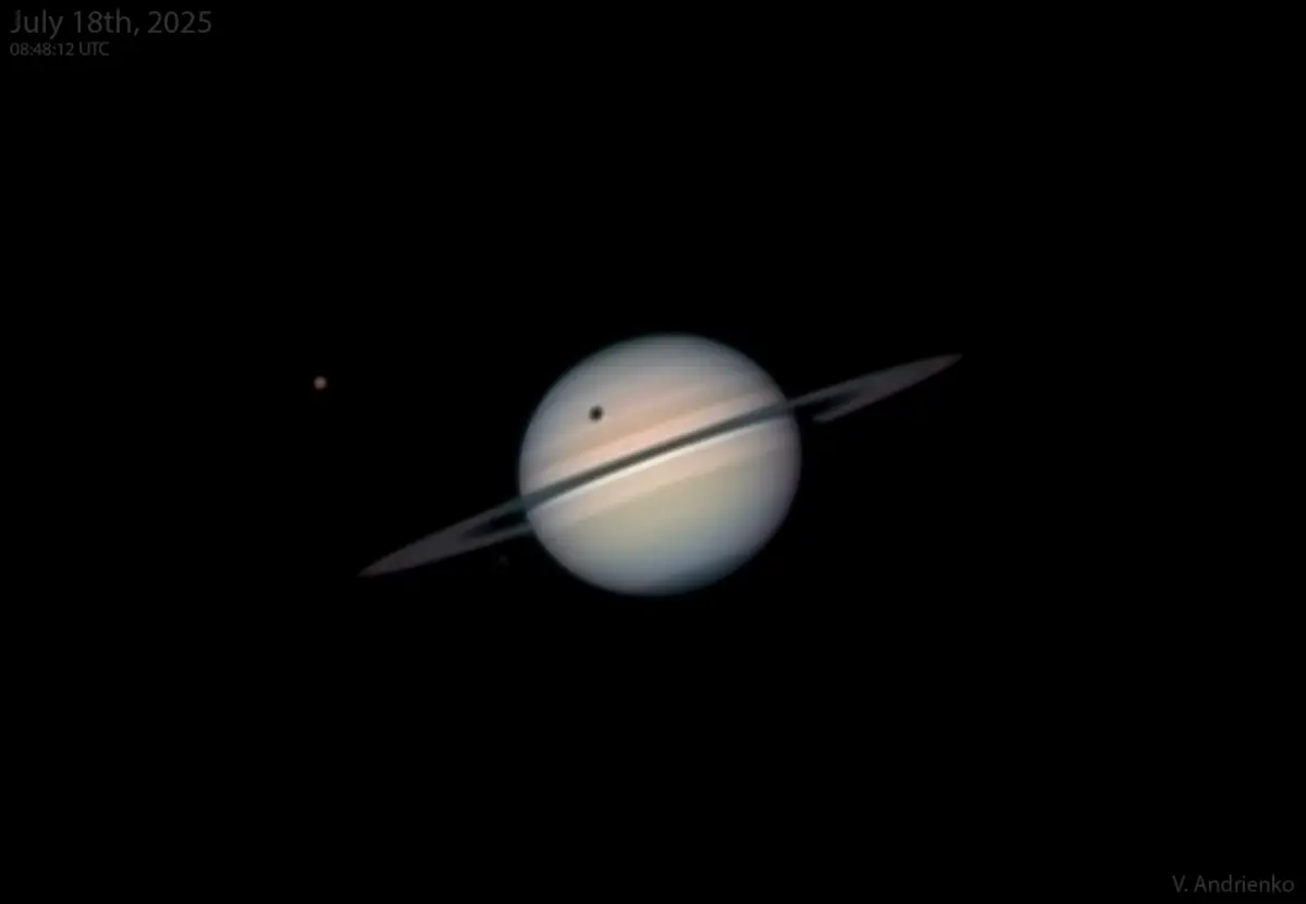 Saturn with the shadow of its moon Titan on the planet, photographed through an amateur telescope on 18 July 2025